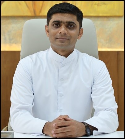Rev. Fr. Staney I. Rodrigues, MSFS, Principal of SFS PU College, at a college function
